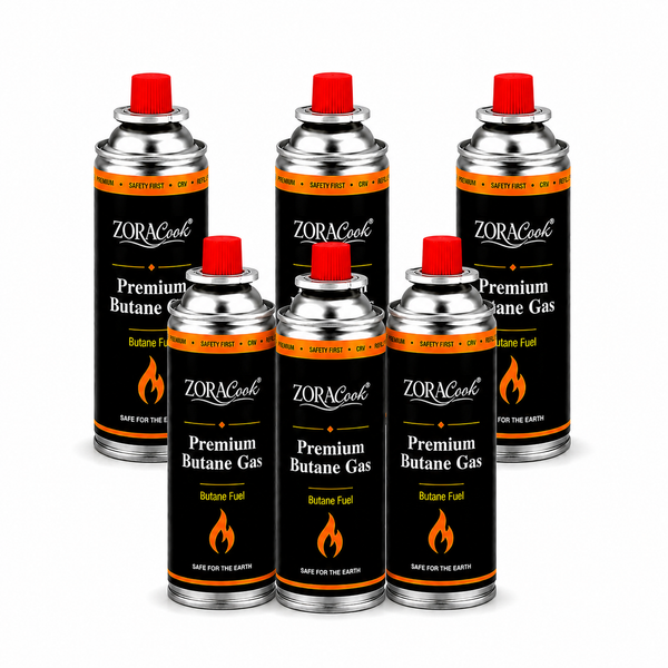 Six ZORACook 225g butane gas canisters arranged in two rows
