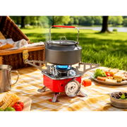 ZORACook Portable Mini Gas Stove boiling a kettle on its blue flame at an outdoor picnic table