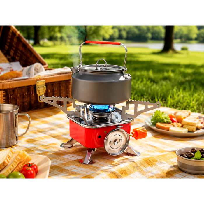 ZORACook Portable Mini Gas Stove boiling a kettle on its blue flame at an outdoor picnic table